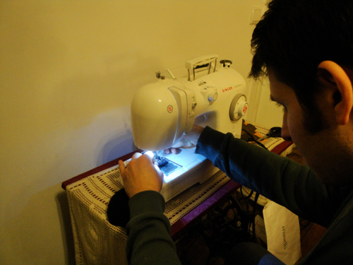 Nissim Schaul sewing the BB-sock piano mutes shut